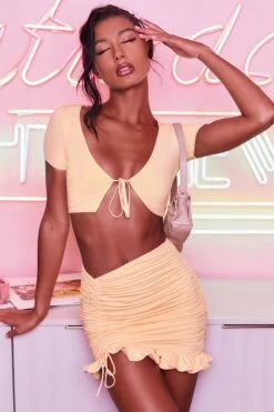 Ruched Bodycon Mini Skirt In Peach -Sway Line Zone 3400 no ties 3409 here for the frill 6 peach front tie plunge crop top capped sleeve high waisted ruched frill skirt 6 2 0a403017 fc99 4c95 8073 78f5b8608741