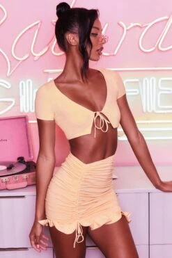 Ruched Bodycon Mini Skirt In Peach -Sway Line Zone 3400 no ties 3409 here for the frill 9 peach front tie plunge crop top capped sleeve high waisted ruched frill skirt 9 2