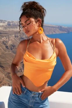 High Tide Halter Chain Crop Top In Orange -Sway Line Zone 4529 7 high tide orange waterfall draped chain detailing satin crop top 1