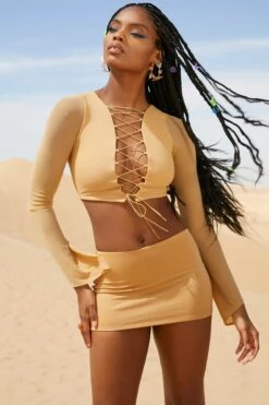 Low Rise Micro Mini Skirt In Beige 14 Low Rise Micro Mini Skirt In Beige -Sway Line Zone 5126 5320 1 Riverside Beige Lace Up Long Sleeve Crop Top Low Rise Mini Skirt 89aee52c 3070 477d bf41 4fe87d80c5fb