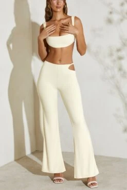 Twist Strap Cut Out Flare Trousers In Ivory -Sway Line Zone 5148 3 Callie Ivory Twost Cut Out Flare Trousers 9c724df3 17af 4444 890e 43ddc5ca3aae
