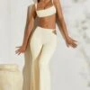 Twist Strap Cut Out Flare Trousers In Ivory