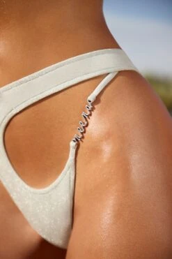 Cut Out Brazilian Bikini Bottoms In Silver 15 Cut Out Brazilian Bikini Bottoms In Silver -Sway Line Zone NS0197 NS0202 7 Lathe Strappy Top Asymmetric Bottoms